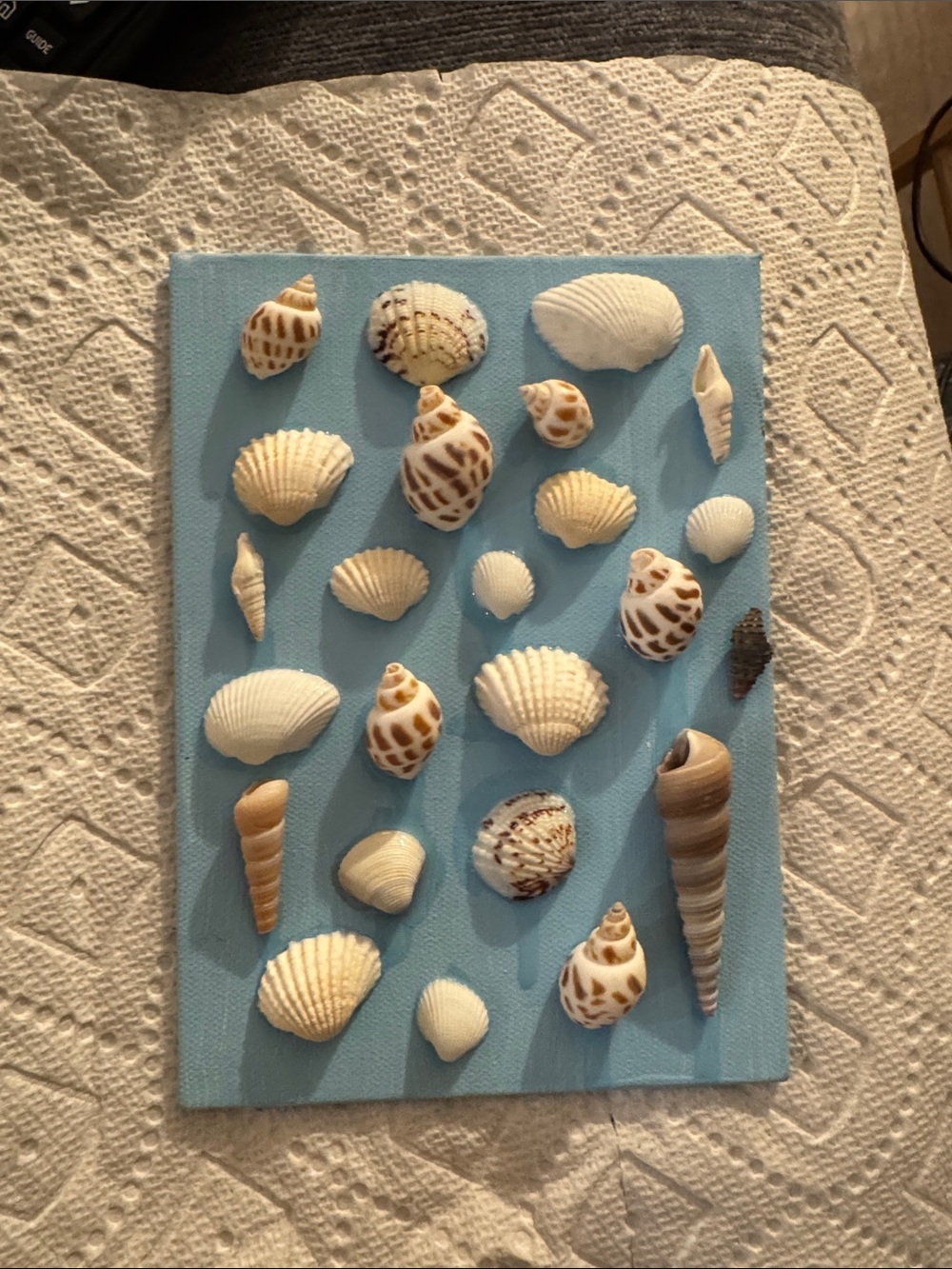 Handmade Coastal Seashell Wall Art on Blue Canvas
